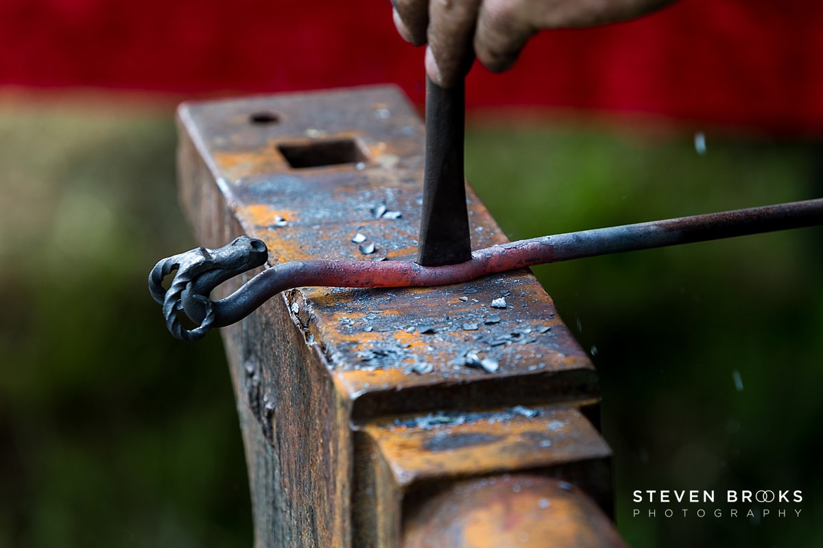 Britain Does Vintage Stody Lodge Norfolk photographer steven brooks photographs the blacksmith and his anvil at Britain Does Vintage at Stody Lodge