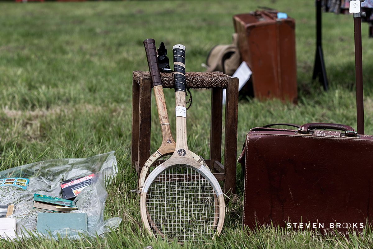 Britain Does Vintage Stody Lodge Norfolk photographer steven brooks photographs two old tennis rackets at Britain Does Vintage at Stody Lodge