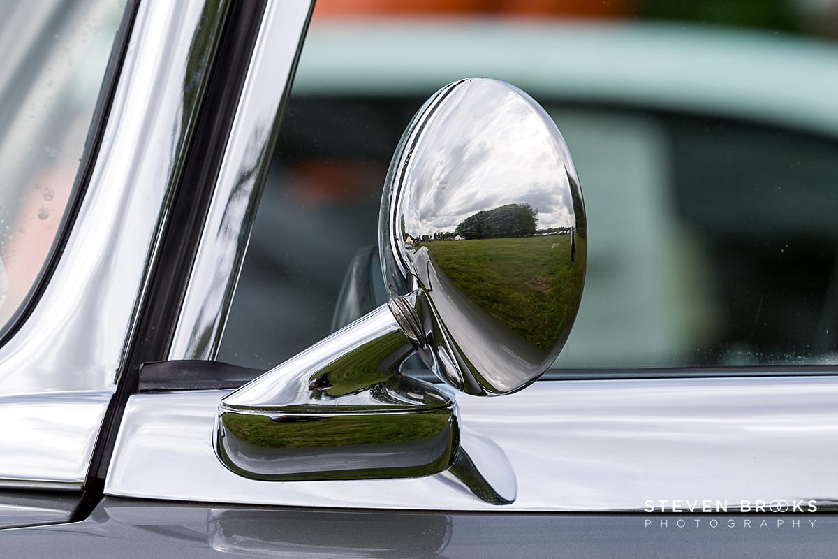 Britain Does Vintage Stody Lodge Norfolk photographer steven brooks photographs a close up of vintage car wing mirror at Britain Does Vintage at Stody Lodge