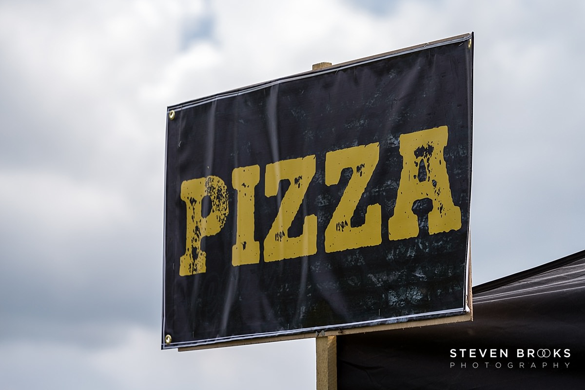 Britain Does Vintage Stody Lodge Norfolk photographer steven brooks photographs a pizza sign at Britain Does Vintage at Stody Lodge