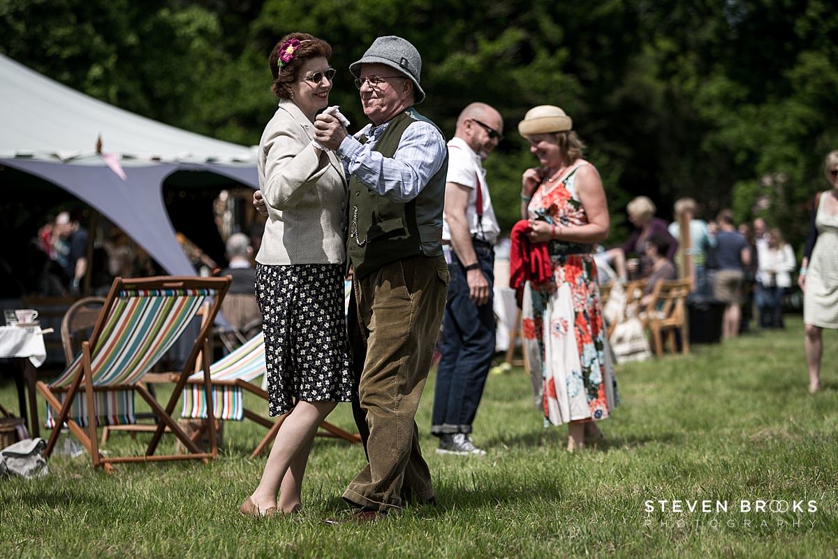 Britain Does Vintage Stody Lodge Norfolk photographer steven brooks photographs a couple dancing in vintage clothes at Britain Does Vintage at Stody Lodge