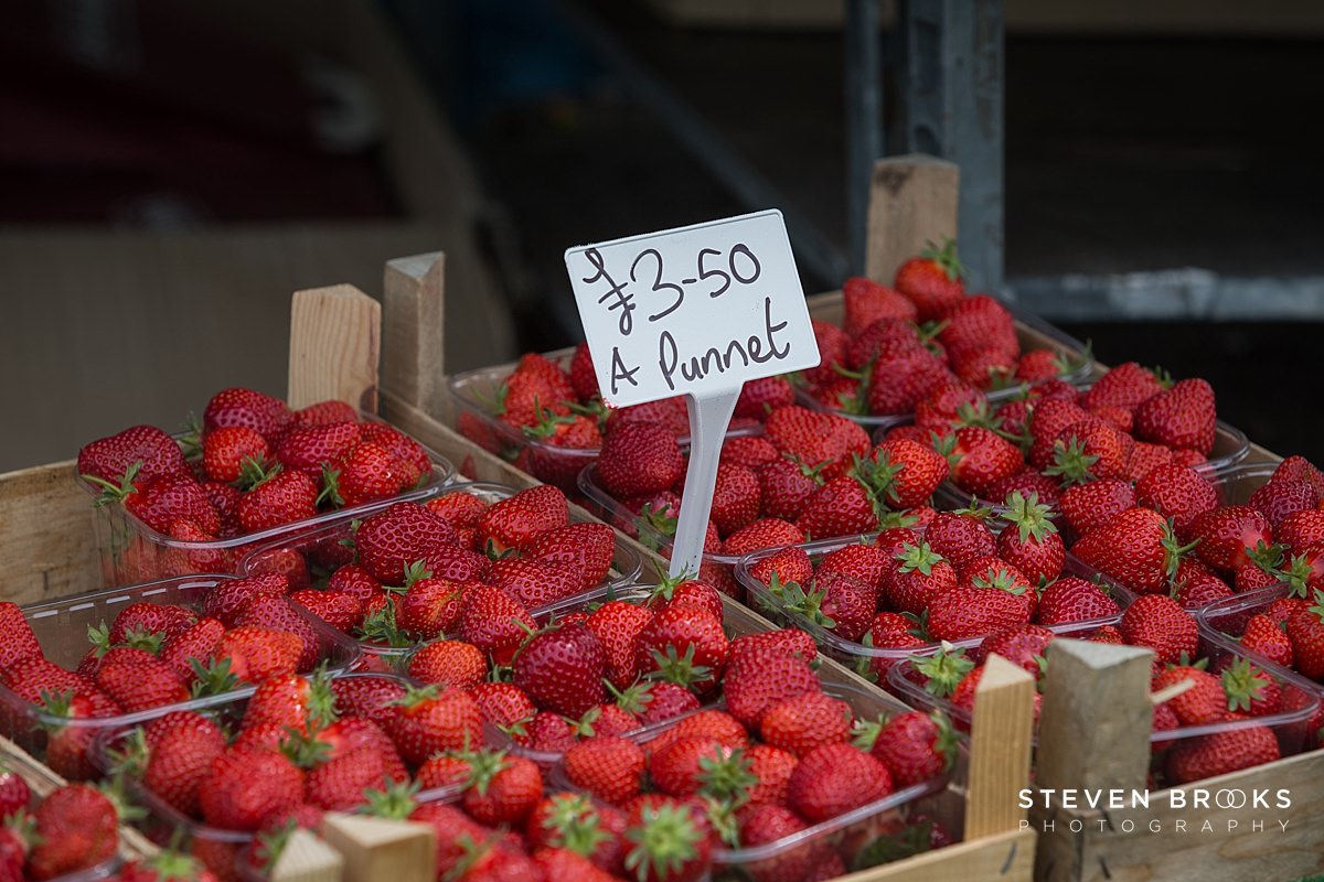 Britain Does Vintage Stody Lodge Norfolk photographer steven brooks photographs fresh strawberries on a stall at Britain Does Vintage in Norfolk