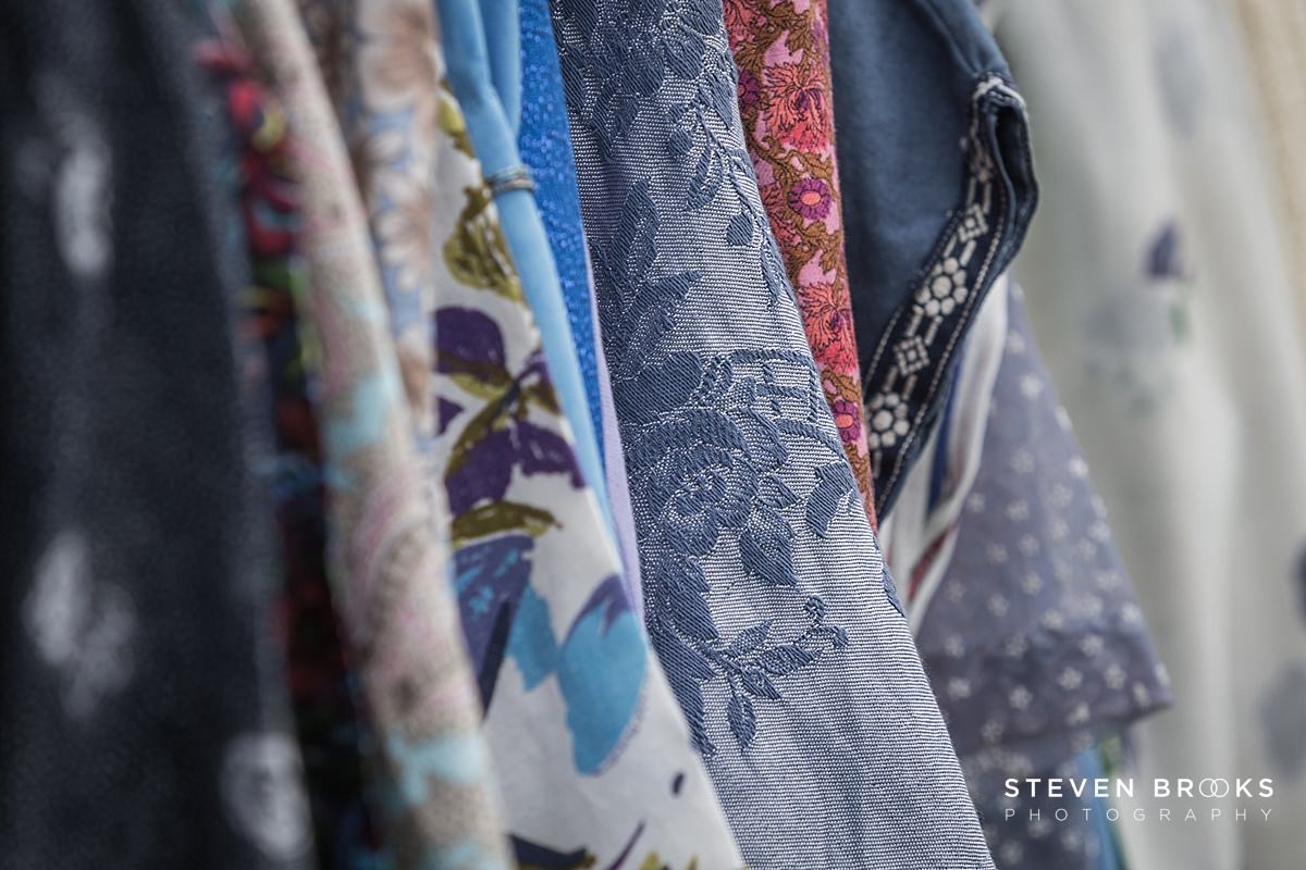 Britain Does Vintage Stody Lodge Norfolk photographer steven brooks photographs a rack of vintage clothes at Britain Does Vintage in Norfolk