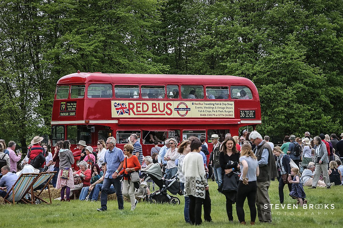Britain Does Vintage Stody Lodge Norfolk photographer steven brooks photographs a red bus converted to a cafe at Britain Does Vintage in Norfolk