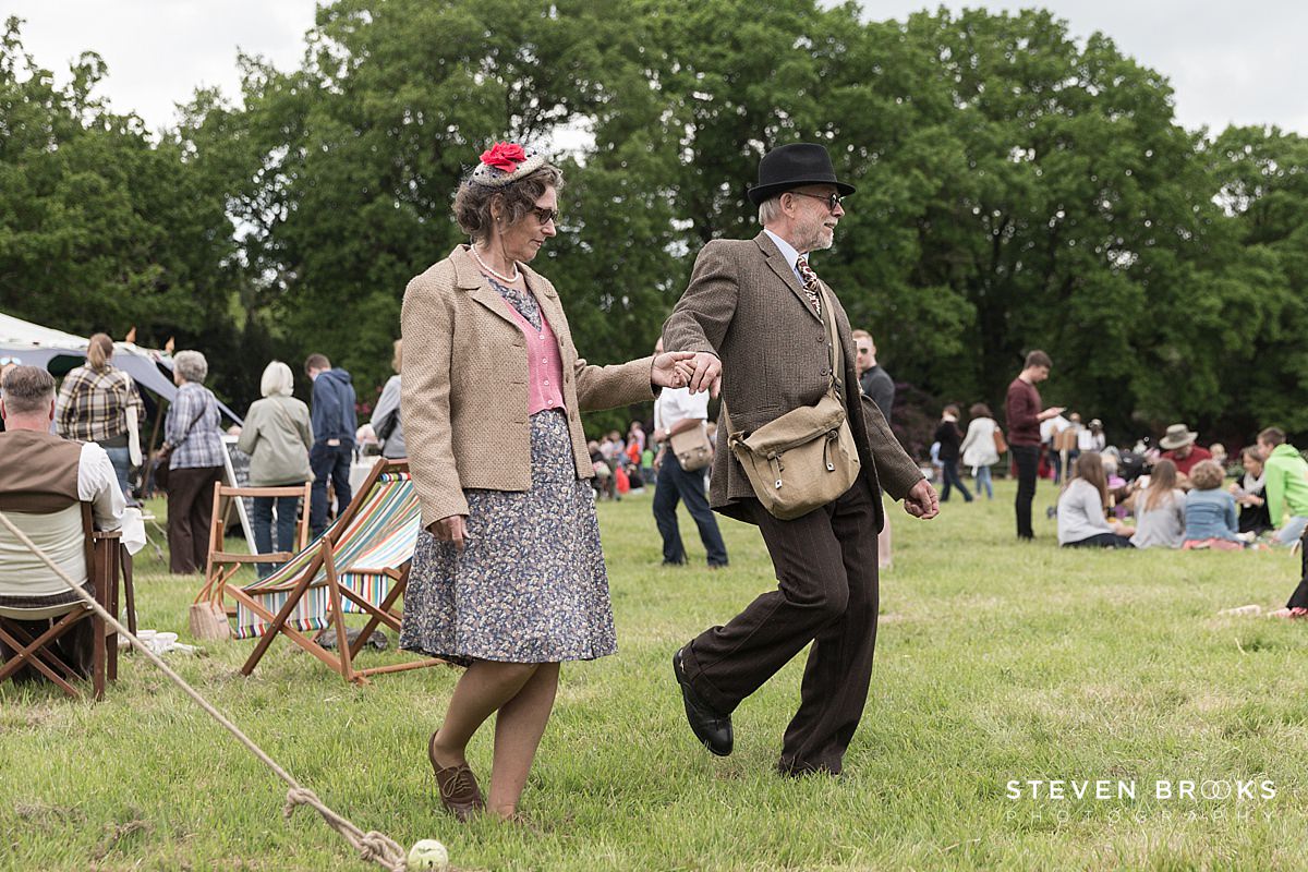 Britain Does Vintage Stody Lodge Norfolk photographer steven brooks photographs a couple in vintage clothes demonstrating a dance at Britain Does Vintage in Norfolk