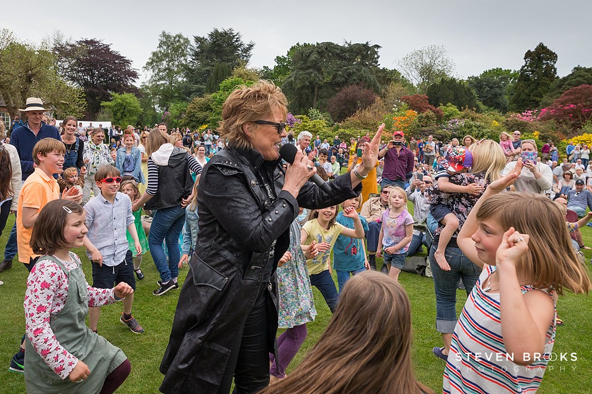 Britain Does Vintage Stody Lodge Norfolk photographer steven brooks photographs Katrina from Katrina and the Waves singing and dancing at Britain Does Vintage in Norfolk