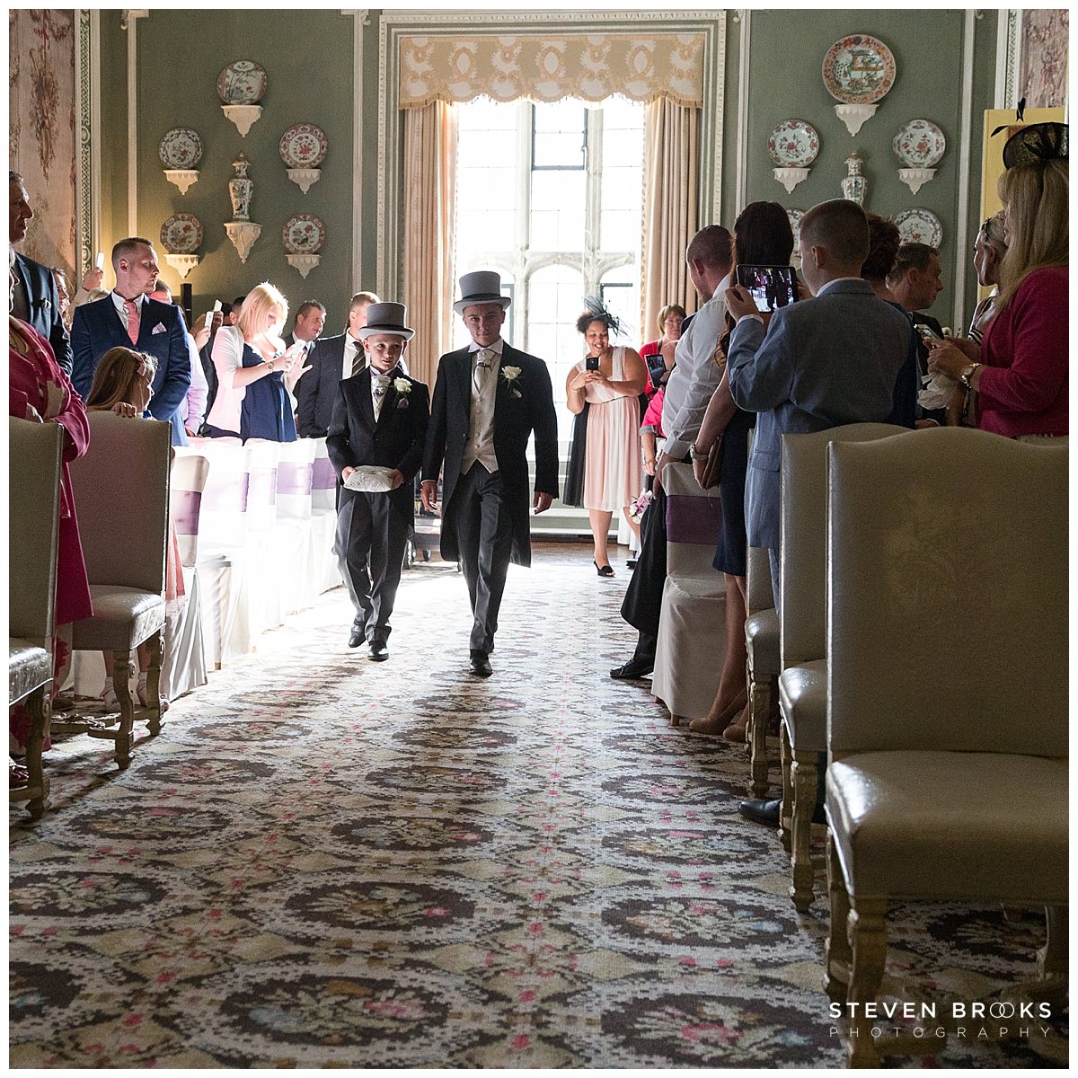 Maria & Trevor: Leeds Castle Leeds Castle wedding photographer steven brooks photographs bridal party entering the wedding cermony room